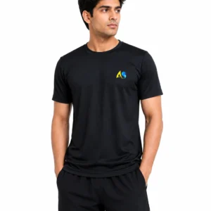 Male model wearing Anushka Sports black performance T-shirt with AS chest logo on a white studio background.